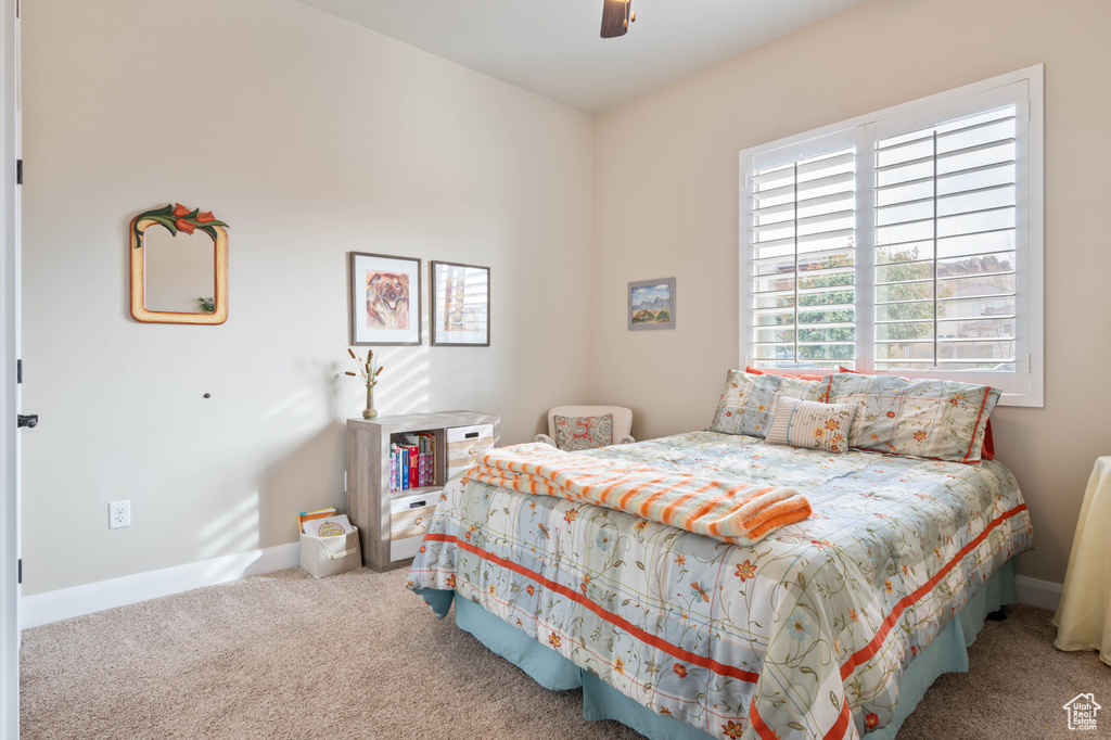 Bedroom featuring carpet and ceiling fan