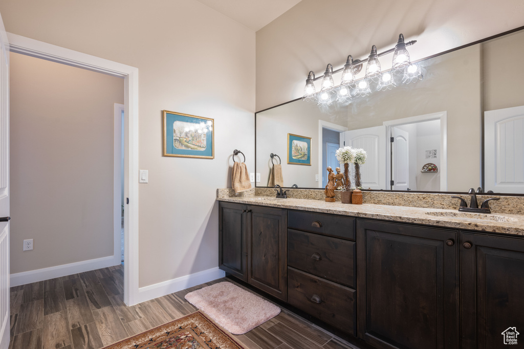Bathroom featuring hardwood / wood-style floors and vanity