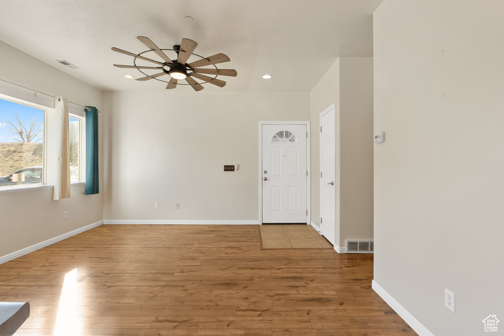 Interior space featuring light wood-type flooring and ceiling fan