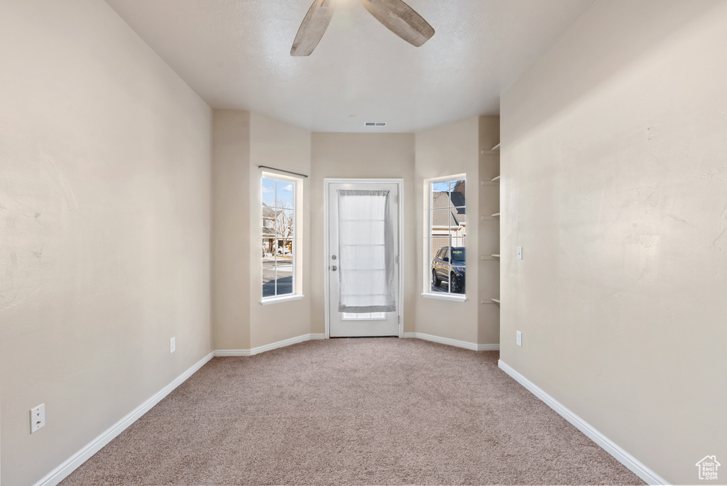 Interior space featuring ceiling fan