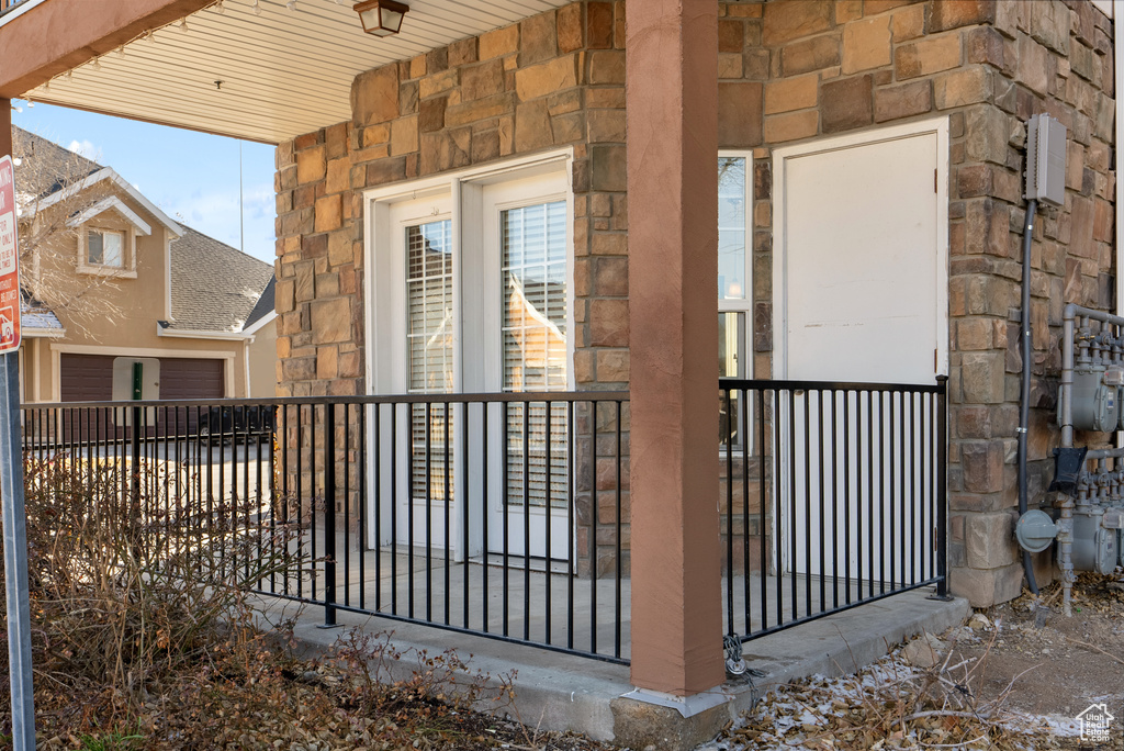 Doorway to property featuring a porch