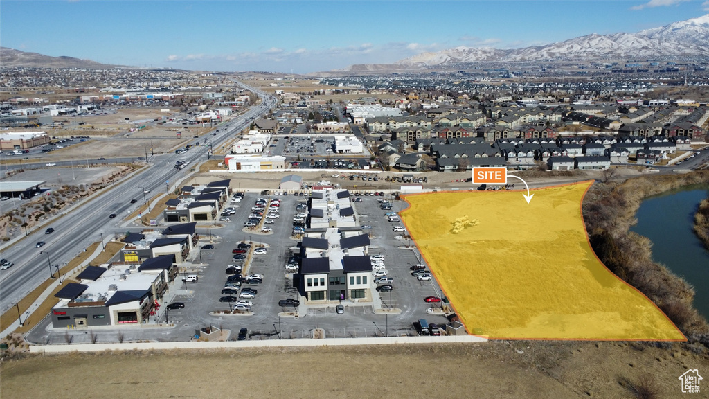 Birds eye view of property with a mountain view