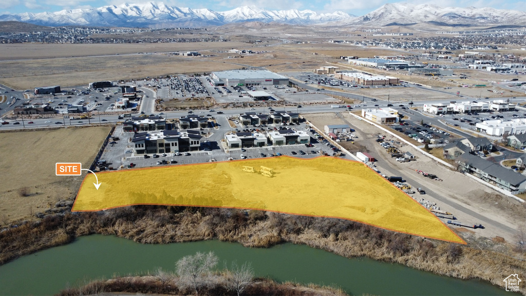 Aerial view featuring a water and mountain view