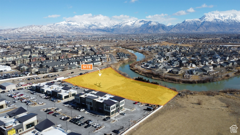 Aerial view featuring a water and mountain view