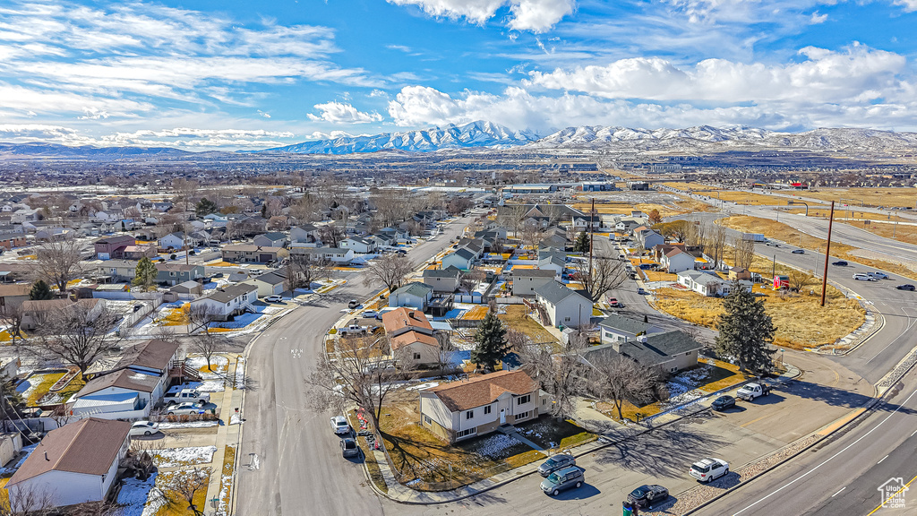 Birds eye view of property with a mountain view