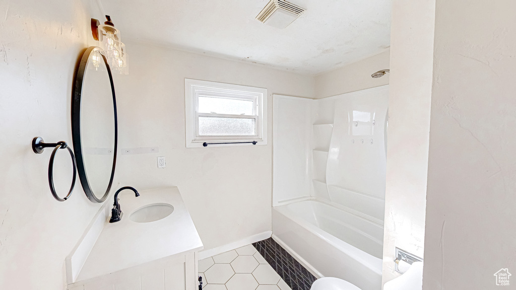 Full bathroom with vanity, toilet, and washtub / shower combination