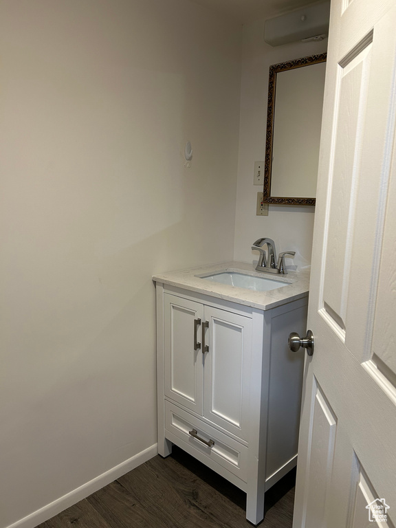 Bathroom featuring hardwood / wood-style flooring and vanity