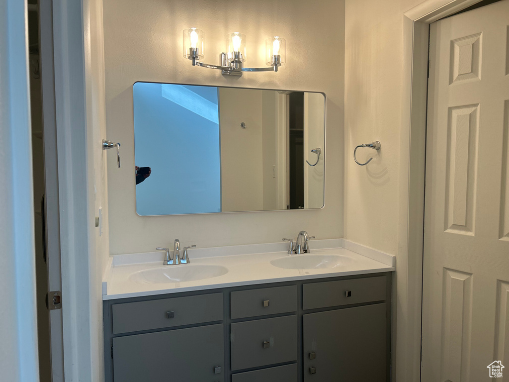 Bathroom featuring double vanity and a sink