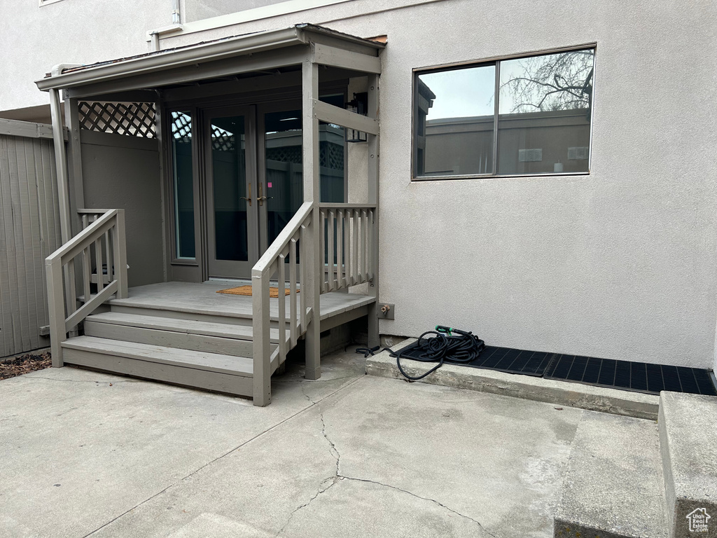 View of exterior entry with a patio area and french doors