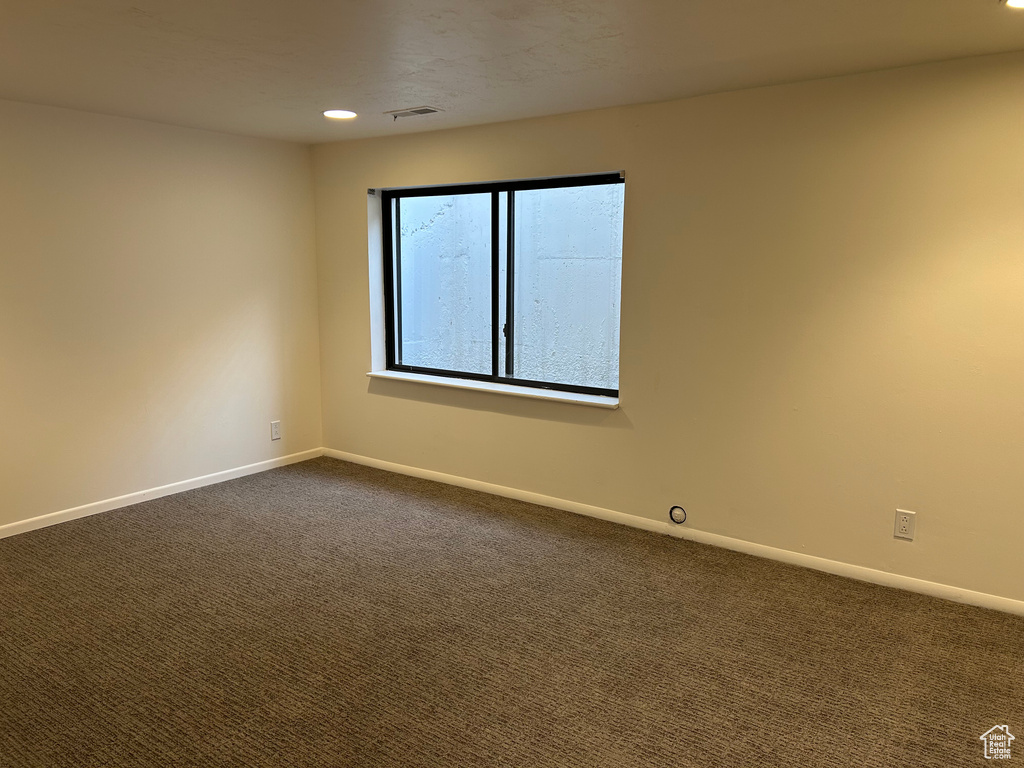View of carpeted spare room