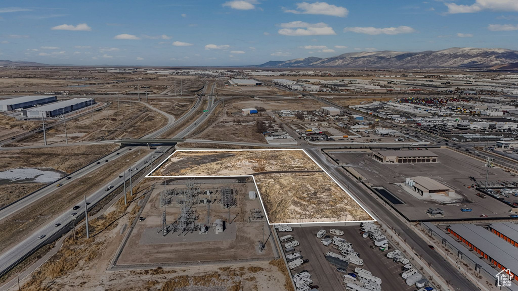 Birds eye view of property with a mountain view