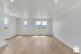 Spare room with light hardwood / wood-style flooring