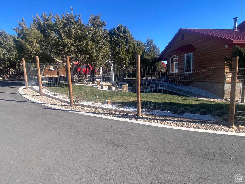 View of yard featuring fence