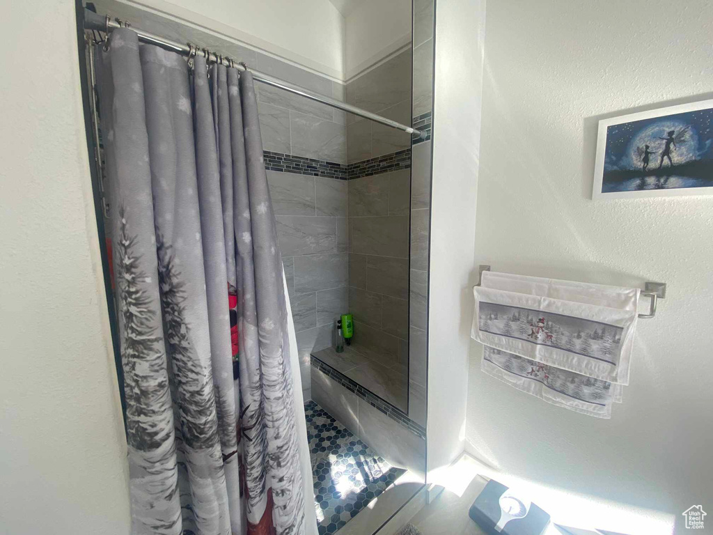 Full bath featuring a stall shower