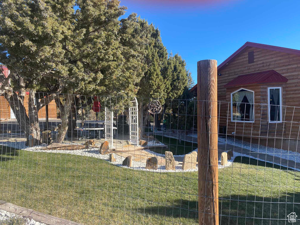 View of yard featuring fence