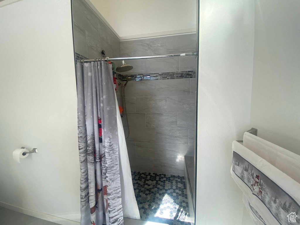 Full bathroom with a shower stall