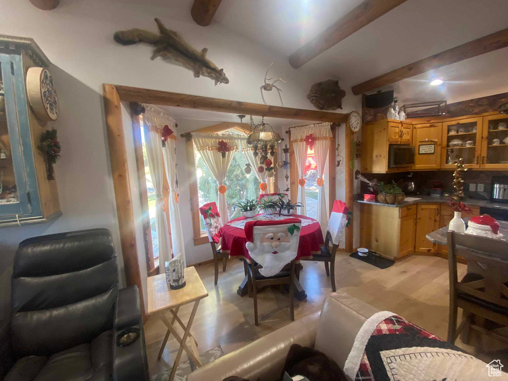 Dining space with beamed ceiling