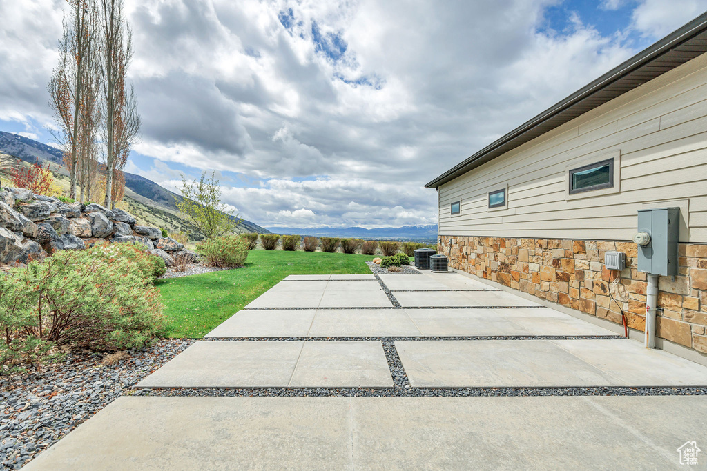 Exterior space with central AC and a mountain view