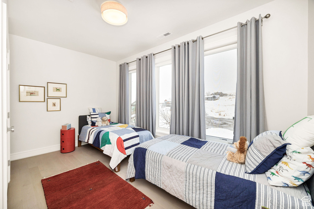 Bedroom featuring wood-type flooring