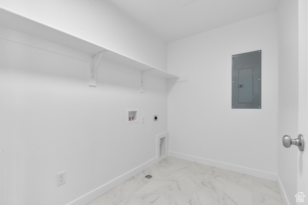 Washroom featuring electric panel, baseboards, hookup for an electric dryer, and washer hookup