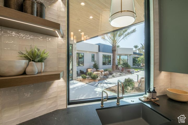 Details featuring sink and tasteful backsplash