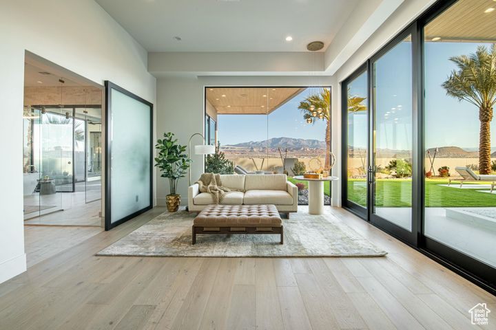 Sunroom featuring a mountain view