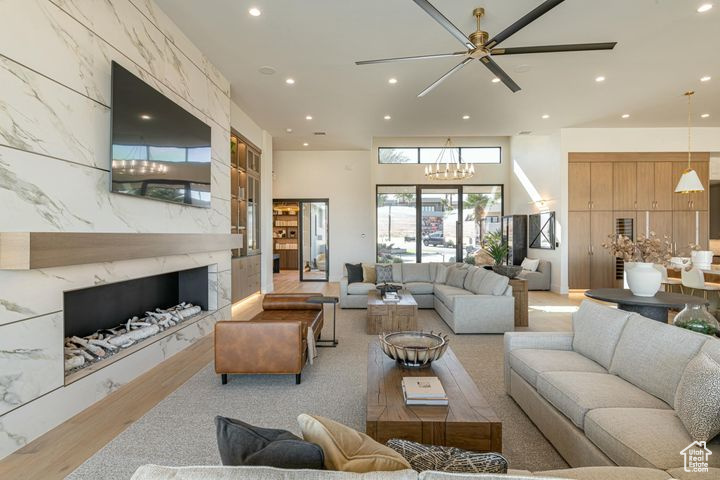 Living room featuring an inviting chandelier and a premium fireplace