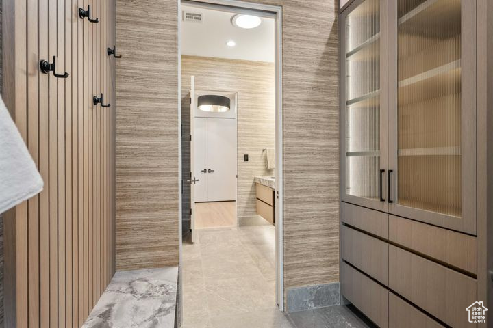 Hall with light tile patterned floors