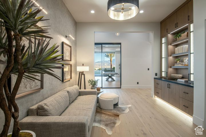 Living area with light hardwood / wood-style floors