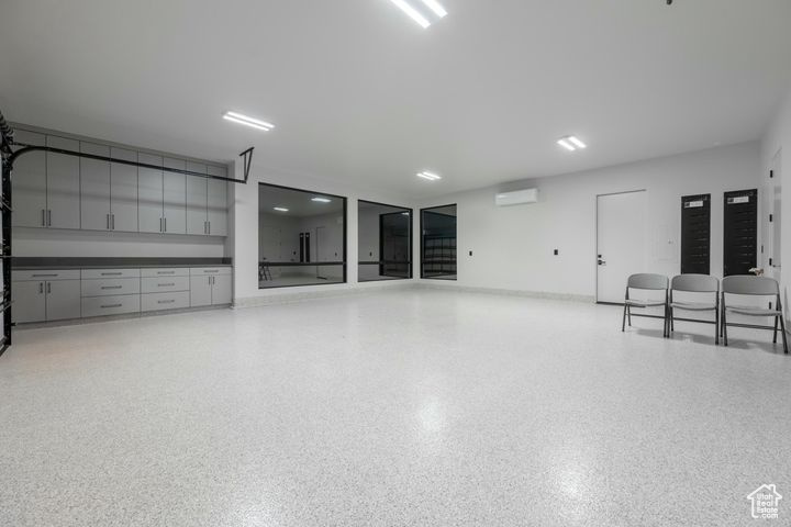 Garage featuring an AC wall unit