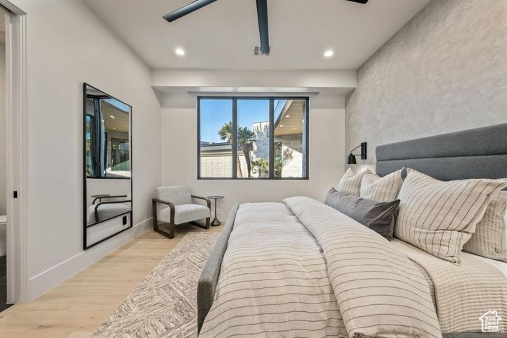 Bedroom featuring ceiling fan and light hardwood / wood-style flooring