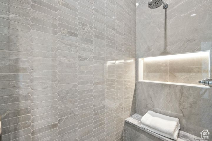 Bathroom with rustic walls and walk in shower