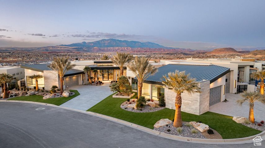 View of front of property featuring a mountain view and a garage