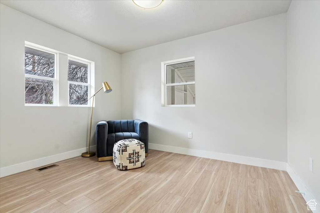 Unfurnished room featuring light wood-type flooring