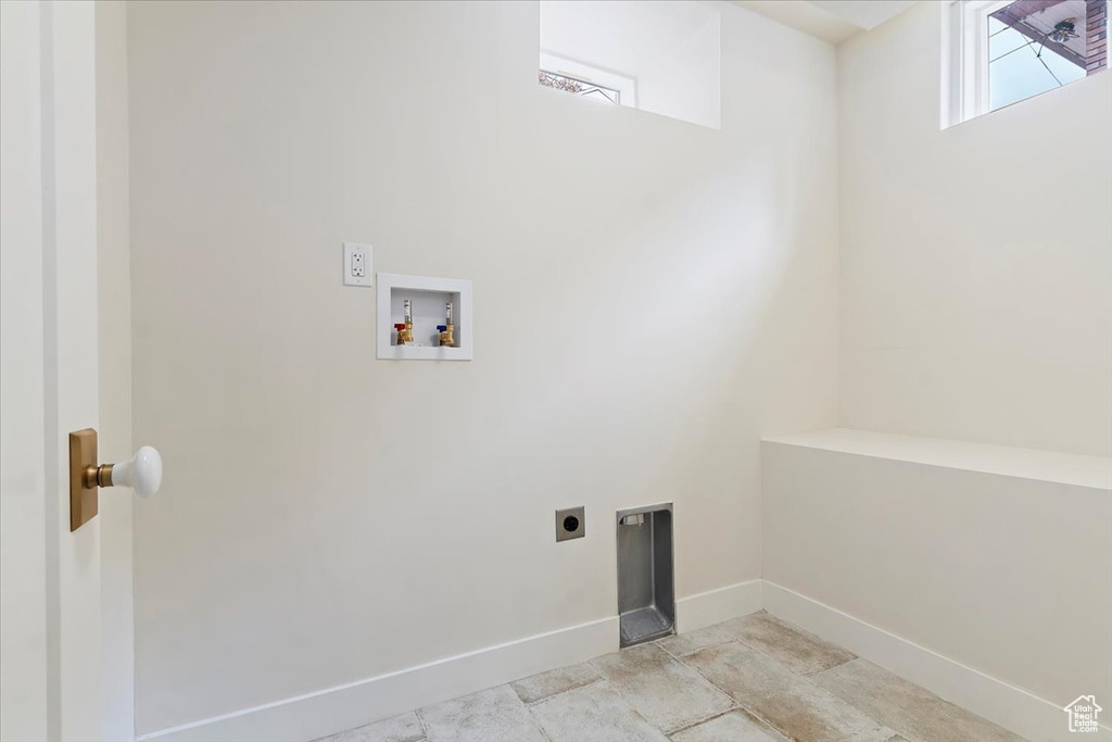 Clothes washing area with washer hookup and electric dryer hookup