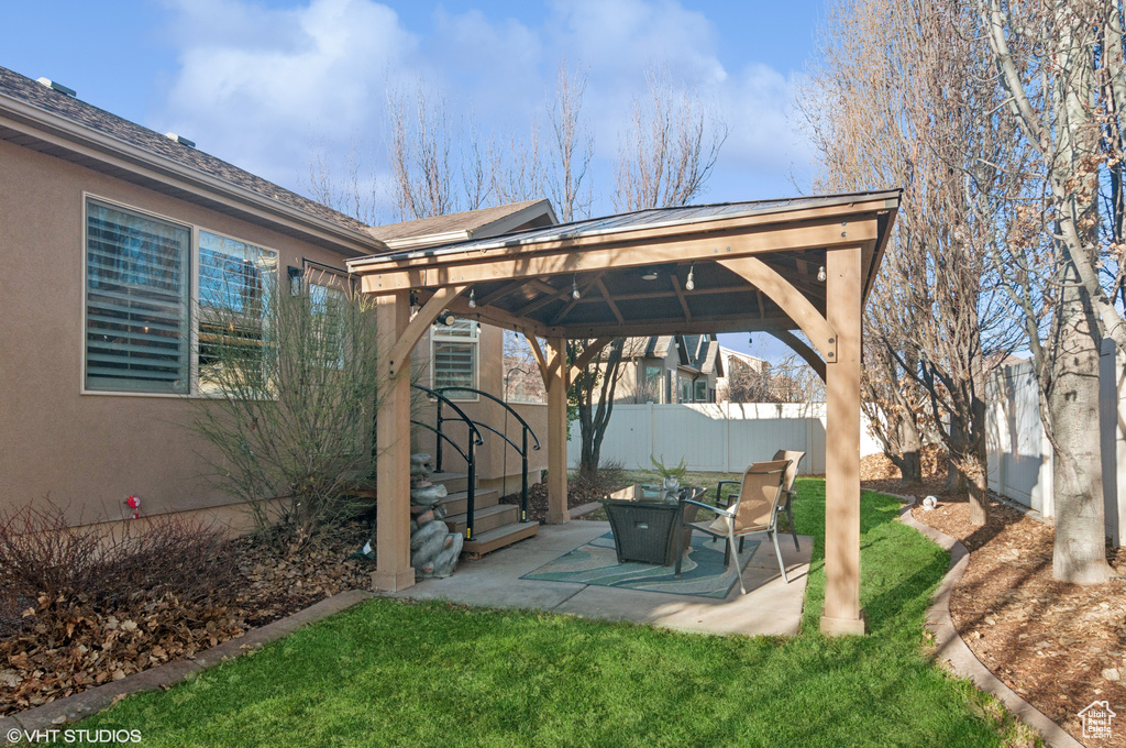 View of yard with a gazebo, a patio area, and a fenced backyard