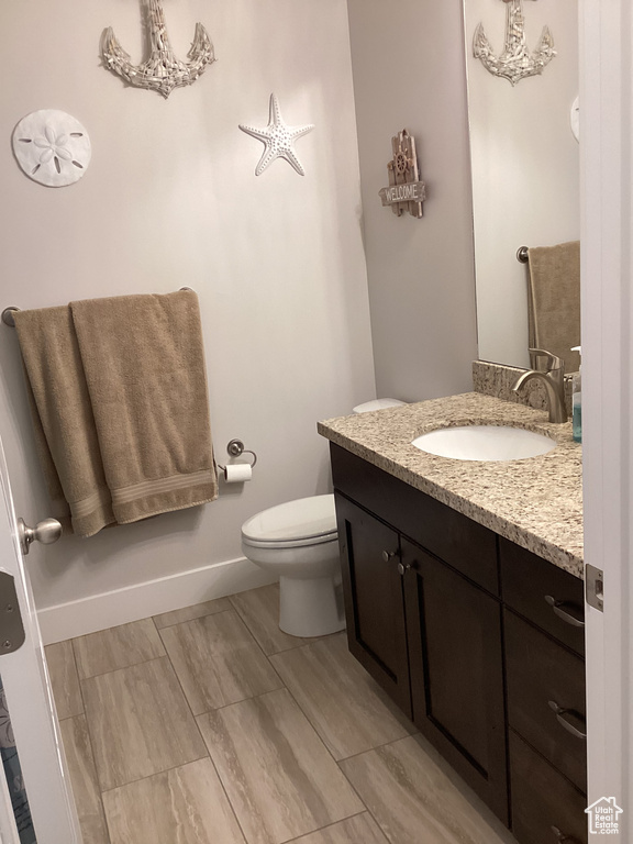Bathroom with toilet and vanity