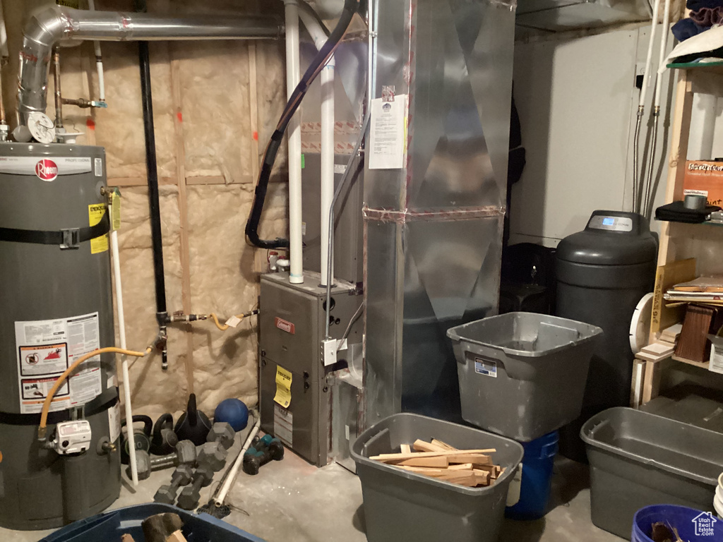 Utilities with heating unit and strapped water heater
