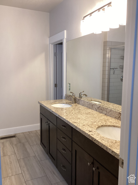 Bathroom with vanity and walk in shower