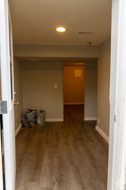 Hall with dark wood-type flooring