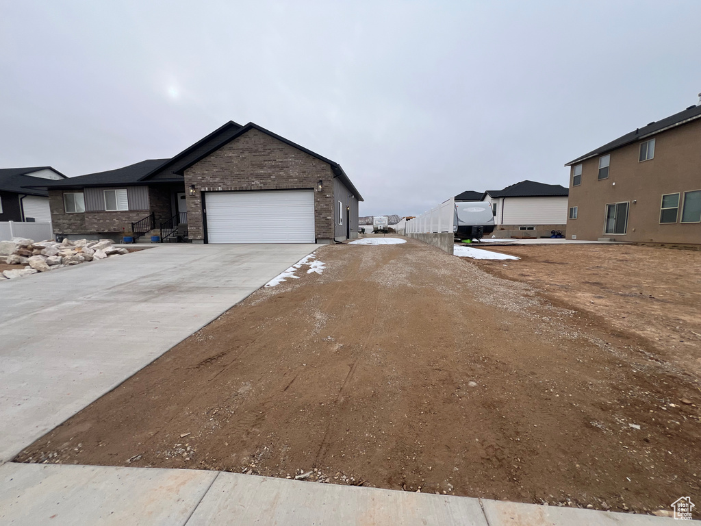 View of side of home with a garage