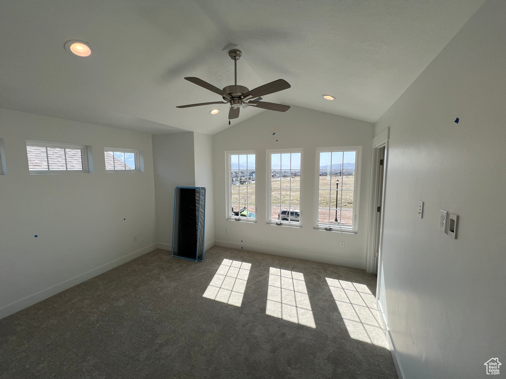Interior space featuring baseboards, recessed lighting, vaulted ceiling, and a ceiling fan