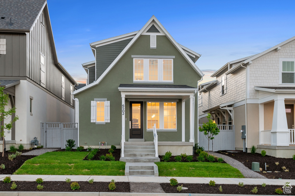 View of front of house with stucco siding
