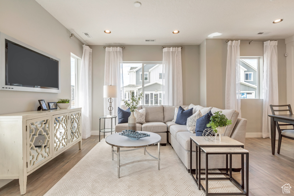 Living room with light hardwood / wood-style flooring