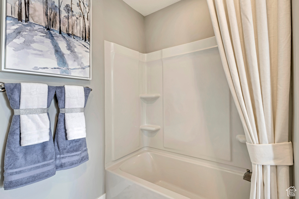 Bathroom with shower / bath combo with shower curtain