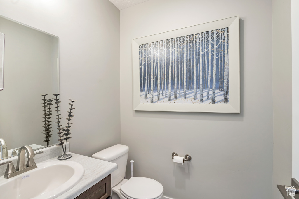 Bathroom featuring vanity and toilet