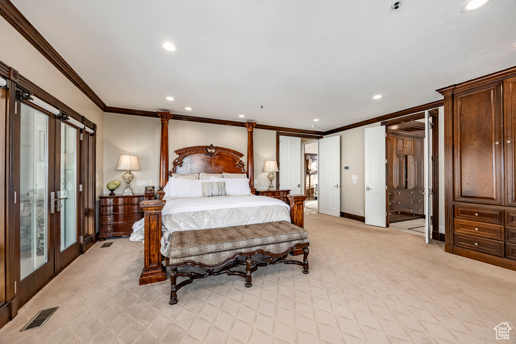 Bedroom with crown molding, recessed lighting, light colored carpet, access to exterior, and baseboards