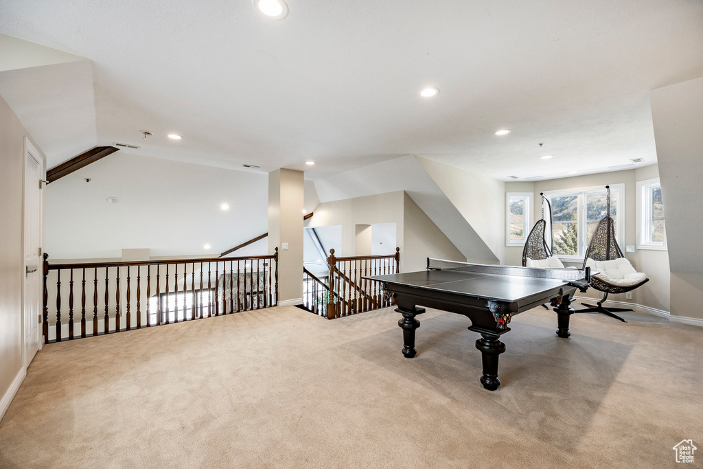 Game room with carpet, recessed lighting, baseboards, lofted ceiling, and attic access