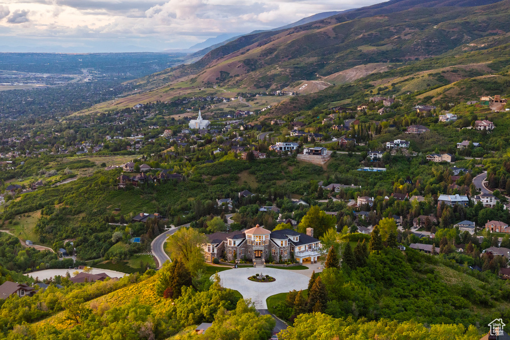 Aerial overview of property's location featuring a mountainous background