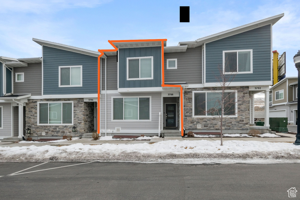 View of front of property featuring stone siding